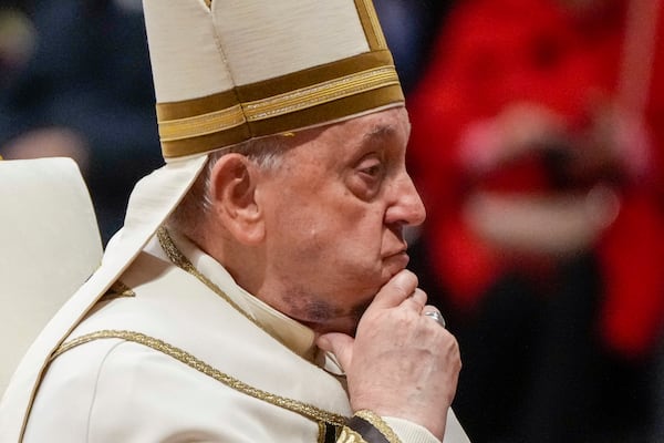 FILE - Pope Francis reacts during a solemn mass where he made 21 new cardinals in St. Peter's Basilica at The Vatican, Saturday, Dec. 7, 2024. (AP Photo/Gregorio Borgia, File)