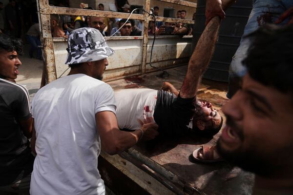 A Palestinian man killed in an Israeli airstrike on central Gaza Strip is brought to Al-Aqsa Hospital in Deir al-Balah, on Saturday, May 17, 2025. (AP Photo/Abdel Kareem Hana)