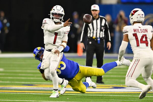 Arizona Cardinals quarterback Kyler Murray (1) throws under pressure from Los Angeles Rams defensive tackle Braden Fiske (55) during the second half of an NFL football game Saturday, Dec. 28, 2024, in Inglewood, Calif. (AP Photo/Alex Gallardo)