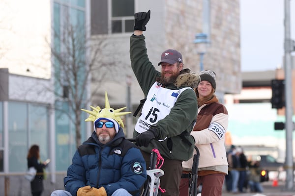 FILE - Jessie Holmes (15), of Alabama, mushes down Fourth Street during the Ceremonial Start of the Iditarod Trail Sled Dog Race in Anchorage, Alaska., Saturday, March 1, 2025. (AP Photo/Amanda Loman, File)