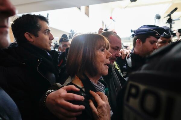 Gisele Pelicot, who was allegedly drugged by her now former husband so that he and others could assault her, arrives at the court house in Avignon, southern France, Thursday, Dec. 19, 2024. (AP Photo/Lewis Joly)