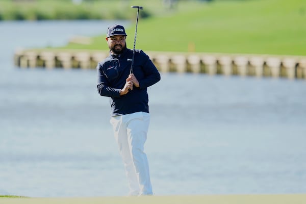 J.J. Spaun reacts to his putt on the 18th green during a playoff round of The Players Championship golf tournament Monday, March 17, 2025, in Ponte Vedra Beach, Fla. (AP Photo/Chris O'Meara)