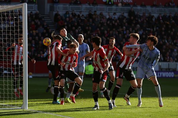 Brentford's Vitaly Janelt, left no. 27, scores an own goal during the English Premier League soccer match between Brentford and Tottenham Hotspur at the Gtech Community Stadium, London, Sunday Feb. 2, 2025. (Steven Paston/PA via AP)