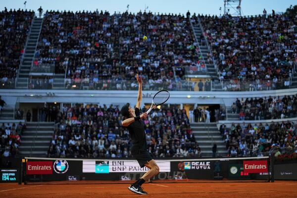 Italy's Jannik Sinner serves against Argentina's Mariano Navone during a second round match at the Italian Open tennis tournament in Rome, Saturday, May 10, 2025. (AP Photo/Andrew Medichini)