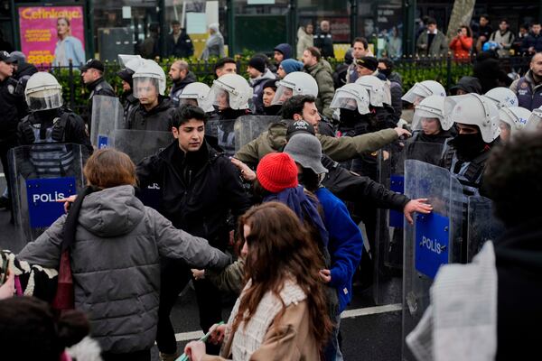 Anti riots police officers block a street as university students march to protest the arrest of Istanbul Mayor Ekrem Imamoglu, at Besiktas district in Istanbul, Turkey, Thursday, March 20, 2025. (AP Photo/Emrah Gurel)