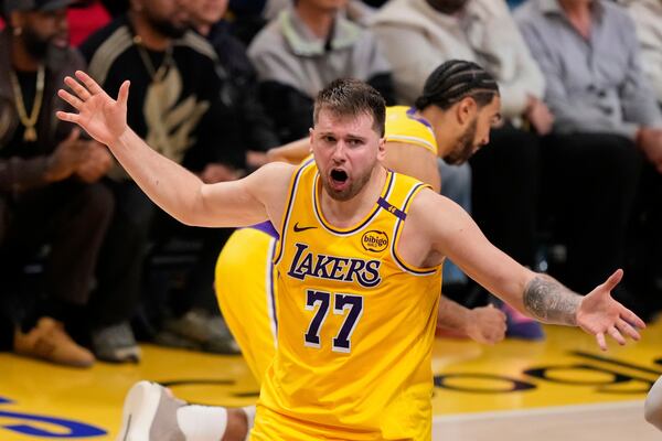 Los Angeles Lakers guard Luka Doncic reacts after not getting a foul call in his favor during the second half in Game 5 of an NBA basketball first-round playoff series against the Minnesota Timberwolves, Wednesday, April 30, 2025, in Los Angeles. (AP Photo/Mark J. Terrill)