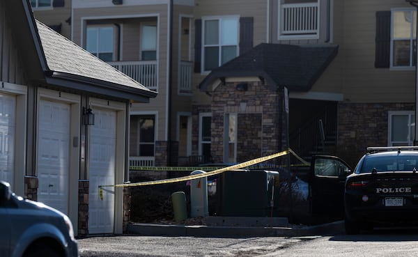 FILE - Police tape marks a crime scene where Colorado Springs police found children dead inside a condo of the Palomino Ranch Point complex after responding to a 911 call reporting a burglary on Tuesday, Dec. 19, 2023 in Colorado Springs, Colo. (Parker Seibold /The Gazette via AP, File)