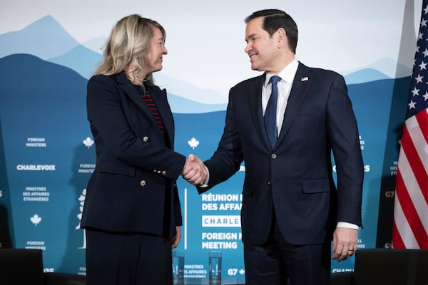 Canadian Foreign Minister Melanie Joly shakes hands with U.S. Secretary of State Marco Rubio during the G7 meeting of foreign ministers in Charlevoix, Quebec, Thursday, March 13, 2025. (Saul Loeb/Pool via AP)