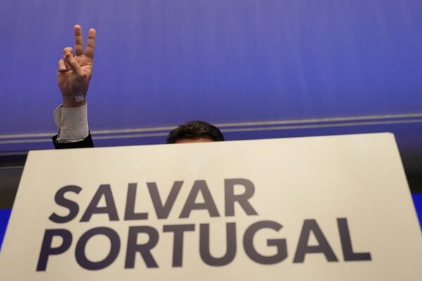 "The hard-right populist party Chega" leader Andre Ventura gestures while addressing media and his supporters, following Portugal's general election, in Lisbon, Monday, May 19, 2025. (AP Photo/Ana Brigida)