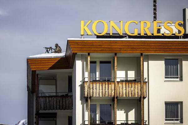 Special police is on guard on the roof of the congress hotel prior to the 55th annual meeting of the World Economic Forum, WEF, in Davos, Switzerland, Monday, Jan. 20, 2025. (Michael Buholzer/Keystone via AP)