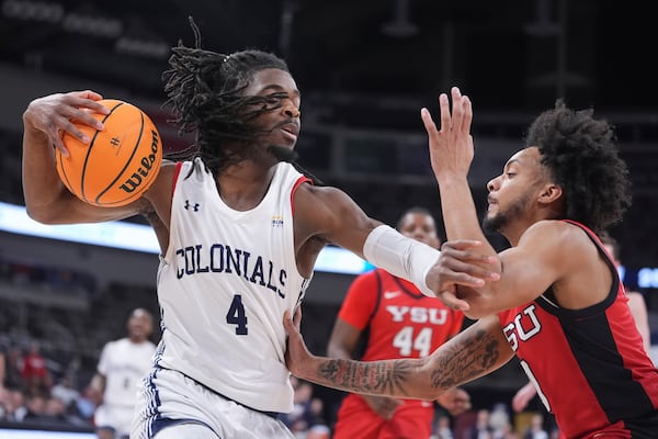 Robert Morris guard Josh Omojafo (4) holds off Youngstown State guard Jason Nelson (0) in the first half of an NCAA college basketball game in the championship of the Horizon League tournament in Indianapolis, Tuesday, March 11, 2025. (AP Photo/Michael Conroy)