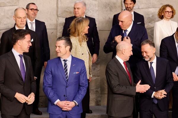 United States Secretary of Defense Pete Hegseth, front second left, speaks with NATO Secretary General Mark Rutte as they pose with other ministers during a group photo of NATO defense ministers at NATO headquarters in Brussels, Thursday, Feb. 13, 2025. (AP Photo/Geert Vanden Wijngaert)