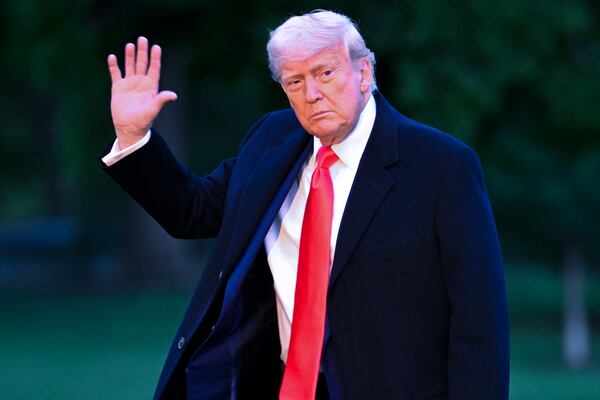 President Donald Trump arrives on the South Lawn of the White House, Thursday, May 22, 2025, in Washington, after attending a crypto dinner at Trump National Golf Club Washington DC. (AP Photo/John McDonnell)