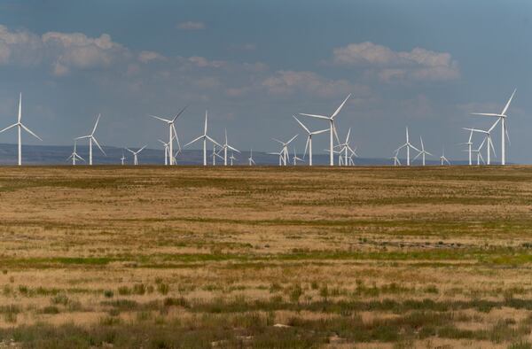 FILE - Wind turbines are seen from Interstate-84, Sunday, July 9, 2023, near Hammett, Idaho. (AP Photo/Lindsey Wasson, File)