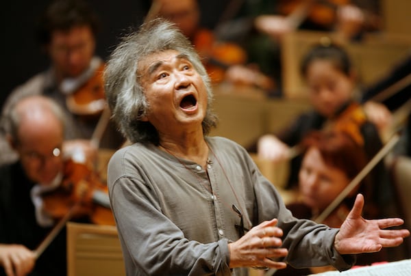 FILE - Former Director of the Boston Symphony Orchestra Seiji Ozawa conducts the orchestra during a rehearsal of Berlioz's "Symphonie Fantastique," at Symphony Hall, in Boston, on Nov. 26, 2008. (AP Photo/Steven Senne, File)