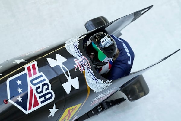 FILE - Kaillie Armbruster Humphries and Lolo Jones, of the United States, speed down the track during the first run of the 2-woman bobsleigh, at the Bobsleigh World Cup in Innsbruck, Austria, Sunday, Jan. 19, 2025. (AP Photo/Matthias Schrader)