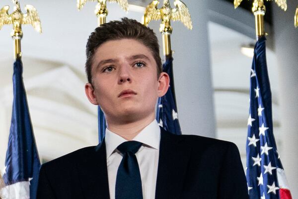 FILE - Barron Trump stands on the South Lawn of the White House on the fourth day of the Republican National Convention in Washington, Aug. 27, 2020. (AP Photo/Evan Vucci, File)