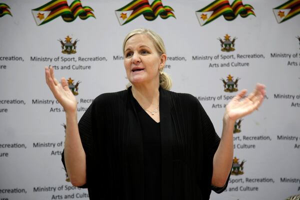 Newly elected International Olympic Committee IOC President Kirsty Coventry speaks at the Robert Gabriel Mugabe Airport in Harare, Zimbabwe, Sunday, March 23, 2025. (AP Photo/Aaron Ufumeli)