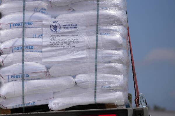 Trucks carrying humanitarian aid for the Gaza Strip are seen at the Kerem Shalom Crossing in southern Israel, Monday, May 19, 2025. A day after Israel said it would resume allowing aid into the territory. (AP Photo/Ohad Zwigenberg)