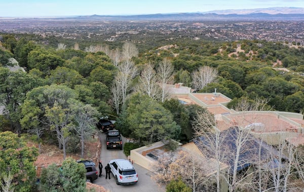 Santa Fe County deputies remain outside the house belonging to actor Gene Hackman and his wife Betsy Arakawa were earlier found dead, Thursday, Feb. 27, 2025 in Santa Fe, N.M. (AP Photo/Roberto E. Rosales)