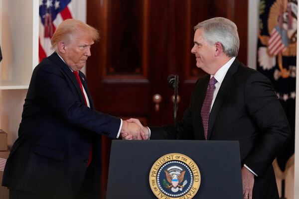 President Donald Trump shakes hands with Chairman and CEO of GE Aerospace Larry Cup Jr. during an event about investing in America in the Cross Hall of the White House, Wednesday, April 30, 2025, in Washington. (AP Photo/Alex Brandon)