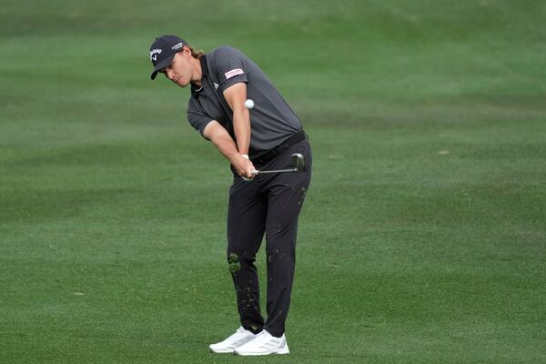 Rasmus Højgaard, of Denmark, hits his approach shot at the second hole during the final round of the Phoenix Open golf tournament at TPC Scottsdale Sunday, Feb. 9, 2025, in Scottsdale, Ariz. (AP Photo/Ross D. Franklin)