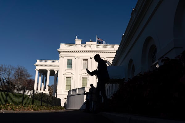 Journalists walk outside of the White House briefing room, in Washington, Tuesday, March 18, 2025.. (AP Photo/Jose Luis Magana)