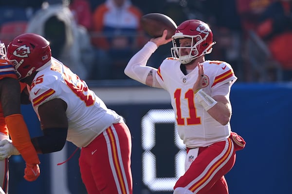 Kansas City Chiefs quarterback Carson Wentz throws during the first half of an NFL football game against the Denver Broncos Sunday, Jan. 5, 2025, in Denver. (AP Photo/David Zalubowski)