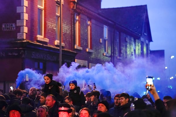 Everton fans ahead the English Premier League soccer match between Everton and Liverpool, Liverpool, England, Wednesday, Feb.12, 2025. (AP Photo/Dave Thompson)