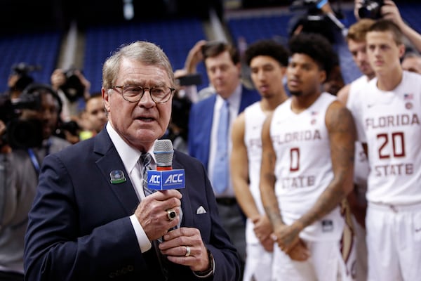 FILE - ,John Swofford, commissioner of the Atlantic Coast Conference, announces the cancellation of the NCAA college basketball games at the ACC tournament due to concerns about the coronavirus, Thursday, March 12, 2020, in Greensboro, N.C. (AP Photo/Ben McKeown, File)