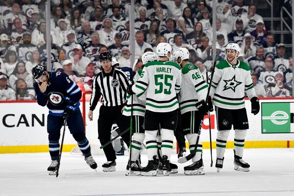 Dallas Stars' Mikko Rantanen, right, celebrates his goal against the Winnipeg Jets with teammates during the second period of an NHL hockey playoff game in Winnipeg, Manitoba, Wednesday, May 7, 2025. (Fred Greenslade/The Canadian Press via AP)
