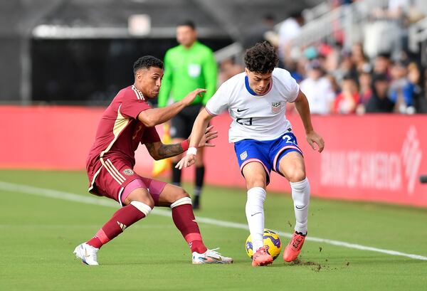 United States forward Caden Clark, right, battles Venezuela defender Anthony Graterol for the ball during the first half of an international friendly soccer game, Saturday, Jan 18, 2025, in Fort Lauderdale, Fla. (AP Photo/Michael Laughlin)