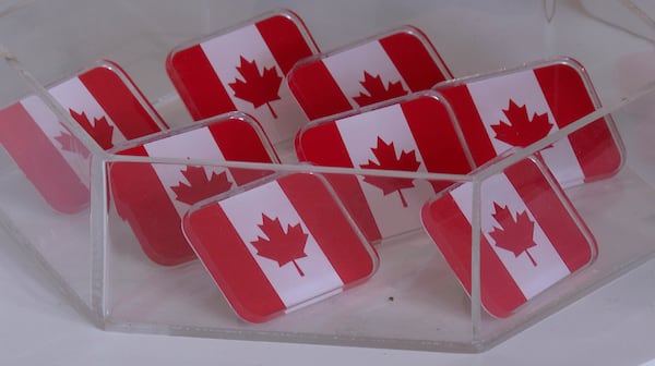 In this image made from video, Canadian flag pins are on display at the Whiskeyjack Boutique gift shop Tuesday, March 4, 2025, in Windsor, Ontario. (AP Photo/Mike Householder)