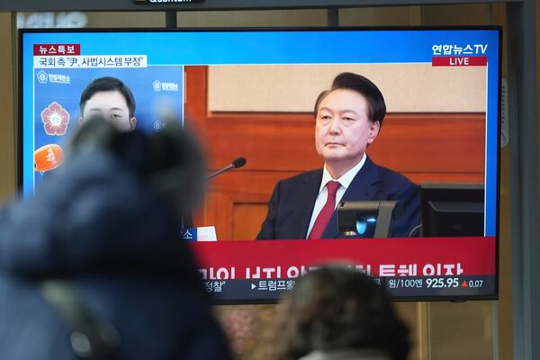 A TV screen shows footage of impeached South Korean President Yoon Suk Yeol during a news program at the Seoul Railway Station in Seoul, South Korea, Tuesday, Jan. 21, 2025. (AP Photo/Lee Jin-man)