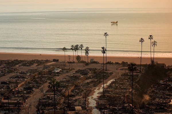 Homes bordering the Pacific Ocean are burned to the ground in the aftermath of the Palisades Fire in the Pacific Palisades neighborhood of Los Angeles, Thursday, Jan. 9, 2025. (AP Photo/Jae C. Hong)