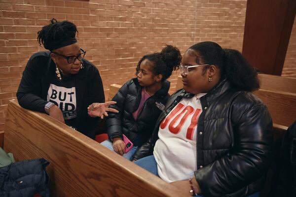 Activist Dana M. Murray, left, speaks to students during a Town Hall and a voter registration for school board elections at the Bethany Baptist Church, Saturday, Feb. 1, 2025, in Newark, N.J. (AP Photo/Andres Kudacki)