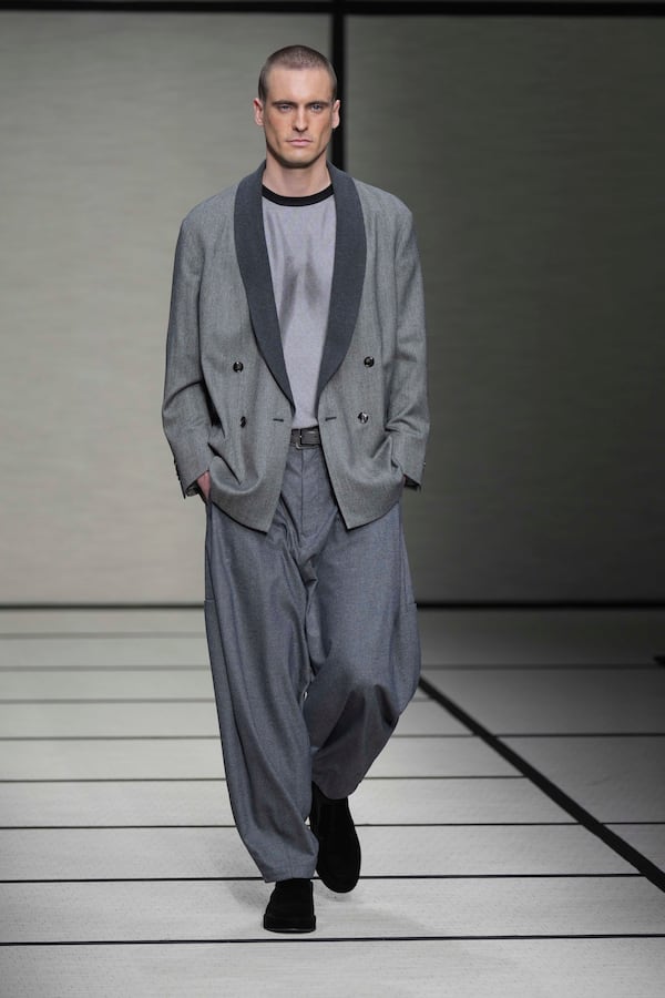 A model wears a creation part of the men's Giorgio Armani Fall-Winter 2025-2026 collection, that was presented in Milan, Italy, Monday, Jan. 20, 2025. (AP Photo/Antonio Calanni)