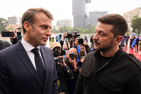 President of France Emmanuel Macron, left, and Ukraine's President Volodymyr Zelenskyy attend a summit where the leaders of 47 European countries and organizations will discuss security, defense and democratic standards, in Tirana, Albania, Friday, May 16, 2025. (Leon Neal/Pool via AP)