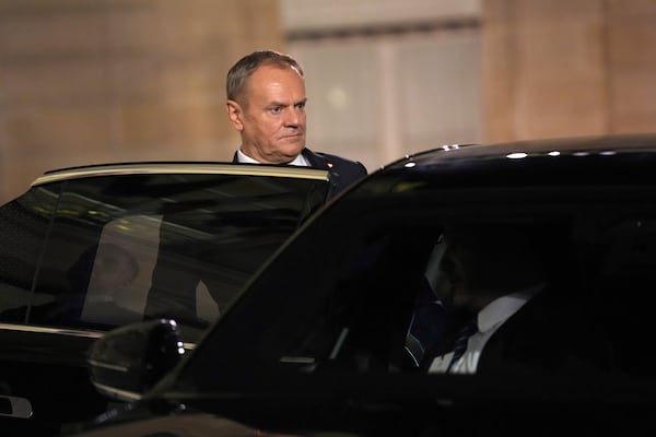 Poland's Prime Minister Donald Tusk gets into his car as he leaves the Elysee Palace, after an informal meeting of leaders from key European Union nations and the United Kingdom, in Paris, Monday, Feb. 17, 2025. (AP Photo/Aurelien Morissard)