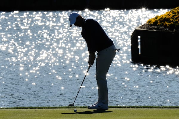 Rory McIlroy, of Northern Ireland, putts on the 17th green during a playoff round of The Players Championship golf tournament Monday, March 17, 2025, in Ponte Vedra Beach, Fla. (AP Photo/Chris O'Meara)