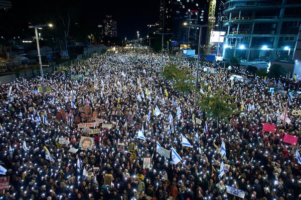 People take part in a protest demanding the immediate release of hostages held by Hamas in the Gaza Strip, in Tel Aviv, Israel, Saturday, March 22, 2025. (AP Photo/Ohad Zwigenberg)