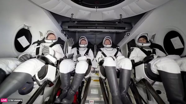 From left, NASA's Butch Wilmore, Russia’s Alexander Gorbunov, NASA’s Nick Hague, and NASA's Suni Williams wait to exit the SpaceX capsule after splashing down, Tuesday, March 18, 2025. (SpaceX via AP)