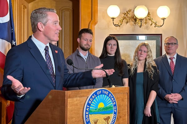 Republican Ohio Lt. Gov. Jon Husted is joined by his family as he speaks at a news conference on Friday, Jan. 17, 2025, in Columbus, Ohio, announcing his appointment to fill the U.S. Senate seat formerly held by Vice President-elect JD Vance. (AP Photo/Julie Carr Smyth)