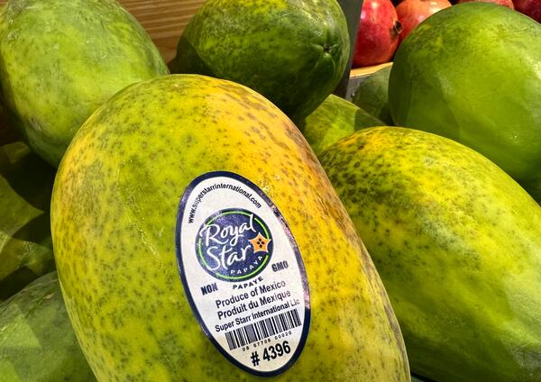 Papayas imported from Mexico are for sale in a supermarket in Miami as the United States imposed 25% tariffs on goods from Canada and Mexico, starting a trade war with its closest neighbors and allies Wednesday, March 5, 2025. (AP Photo/Lynne Sladky)