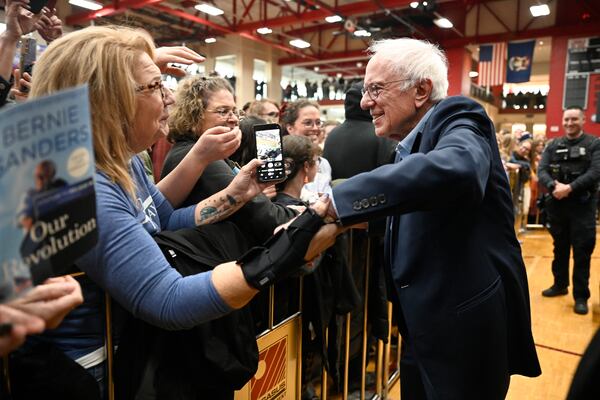 Sen. Bernie Sanders, I-Vt., right, greets the crowd following his speech on "Fighting Oligarchy: Where We Go From Here," Saturday, March 8, 2025 at Lincoln High School in Warren, Mich. (AP Photo/Jose Juarez)