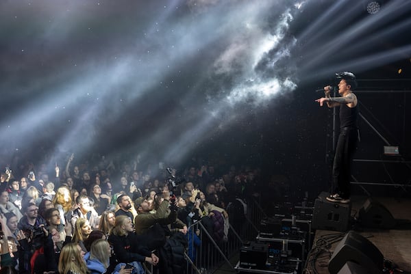 Dmytro Odnorozhenko, solo singer of punk rock band Hatespeech sings during the presentation of the music album Epoch, a collaboration between Ukrainian artists and the 3rd Assault Brigade, in Kyiv, Ukraine, Saturday, Dec. 7, 2024. (AP Photo/Alex Babenko)