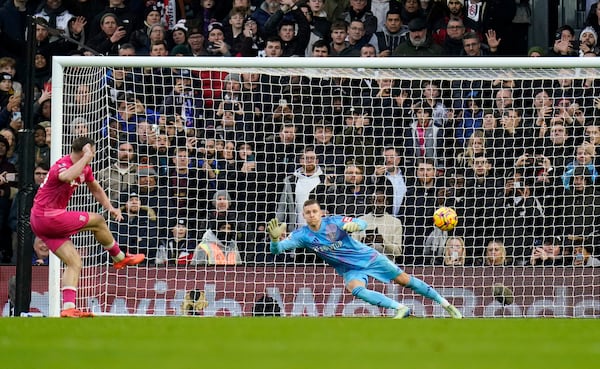 Ipswich Town's Liam Delap, left, scores his sides second goal from the penalty spot during the English Premier League soccer match between Fulham and Ipswich Town at Craven Cottage stadium, London, Sunday Jan. 5, 2025. (Andrew Matthews/PA via AP)