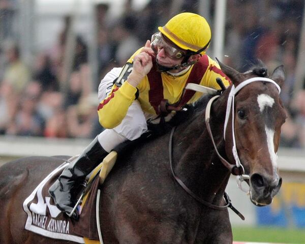 FILE - Jockey Calvin Borel gestures as he rides Rachel Alexandra to victory in the 134th running of the Preakness Stakes horse race at Pimlico Race Course, Saturday, May 16, 2009, in Baltimore. (AP Photo/Garry Jones, File)