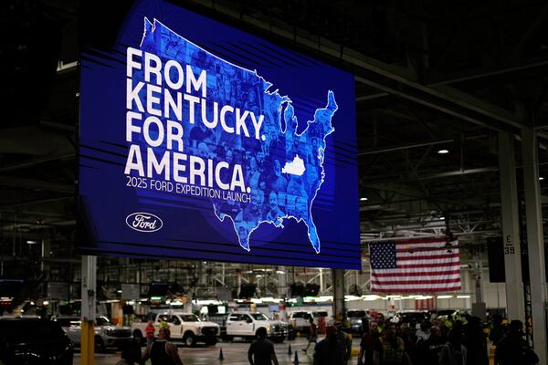 Workers gather at the Ford Motor Company Kentucky Truck Plant for the 2025 Ford Expedition launch, Wednesday, April 30, 2025, in Louisville, Ky. (AP Photo/Carolyn Kaster)