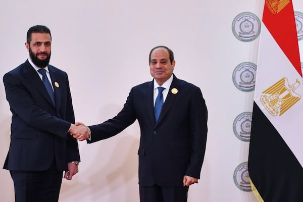 In this photo provided by Egypt's presidency media office, Egyptian President Abdel-Fattah el-Sissi, greets Syria's interim President Ahmad al-Sharaa during the emergency Arab summit at Egypt's New Administrative Capital, just outside Cairo, Tuesday, March 4, 2025. (Egyptian Presidency Media Office via AP)